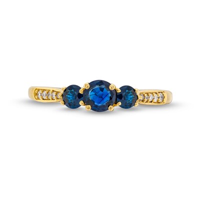 Blue Sapphire and 0.04 CT. T.W. Diamond Three Stone Ring in 10K Gold