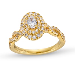 Vera Wang Love Collection Canadian Certified Oval Centre Diamond 0.69 CT. T.W. Twist Shank Engagement Ring in 14K Gold