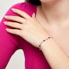 Thumbnail Image 2 of Oval Amethyst and White Lab-Created Sapphire Alternating Infinity Line Bracelet in Sterling Silver - 7.25"