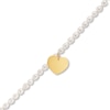 Thumbnail Image 1 of 5.5mm Oval Freshwater Cultured Pearl Strand Bracelet with 14K Gold Heart Charm-8"