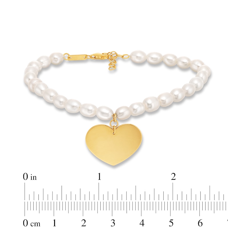 Main Image 4 of 5.5mm Oval Freshwater Cultured Pearl Strand Bracelet with 14K Gold Heart Charm-8"