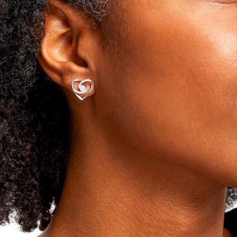 Main Image 2 of 0.20 CT. T.W. Multi-Diamond Bypass Ribbon Heart Stud Earrings in Sterling Silver