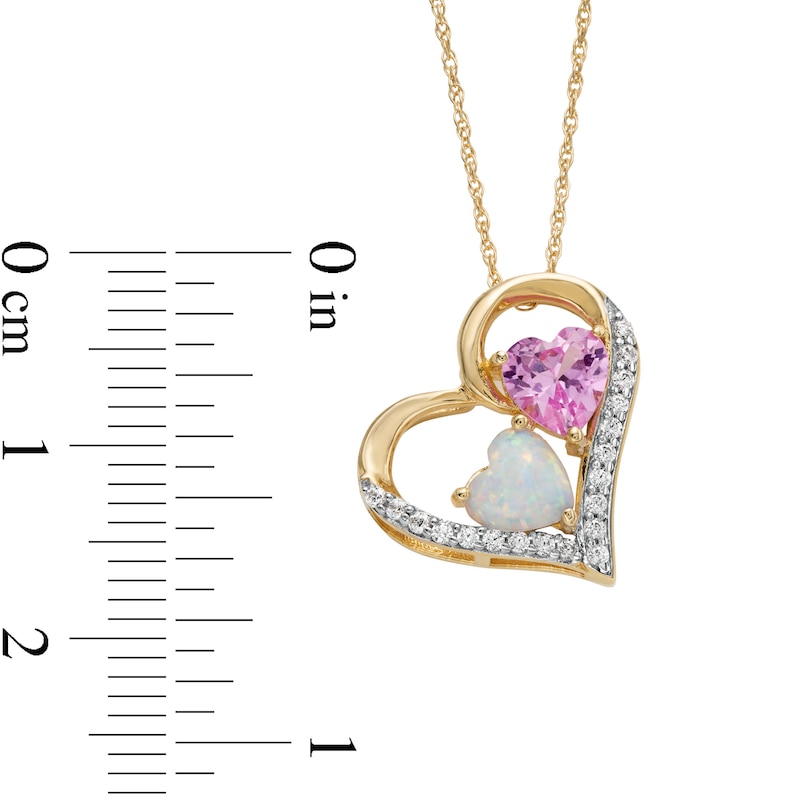 Lab-Created Opal, Pink Lab-Created Sapphire and 0.09 CT. T.W. Diamond Tilted Triple Heart Pendant in 10K Gold