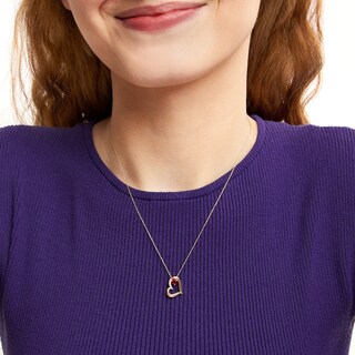 Lab-Created Ruby and 0.04 CT. T.W. Diamond Tilted Heart Pendant in 10K Gold