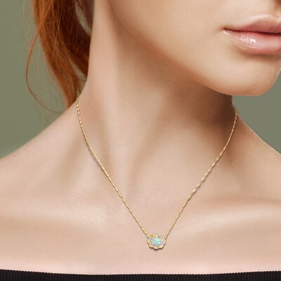 Sideways Oval Blue Opal and 0.08 CT. T.W. Diamond Twist Frame Necklace in 10K Gold - 17"