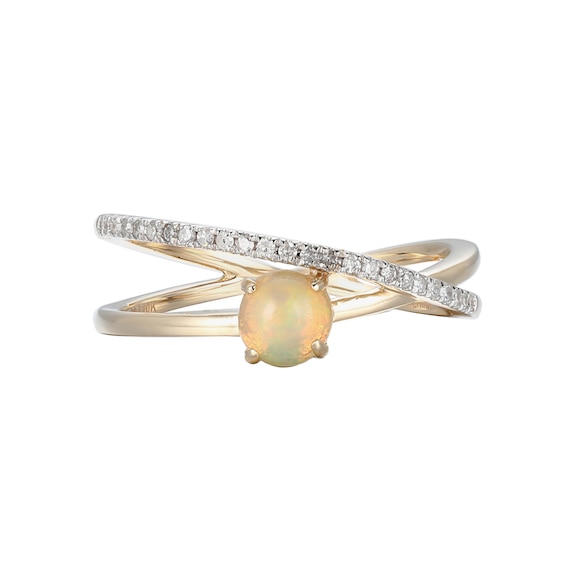 5.0mm Opal and 0.10 CT. T.W. Diamond Orbit Ring in 10K Gold