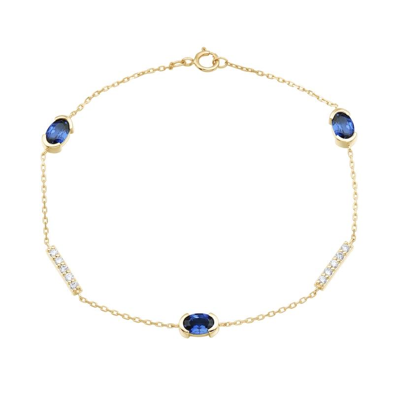 Main Image 1 of Oval Blue Lab-Created Sapphire and 0.18 CT. T.W. Certified Lab-Grown Diamond Station Bracelet in 10K Gold - 7.25”