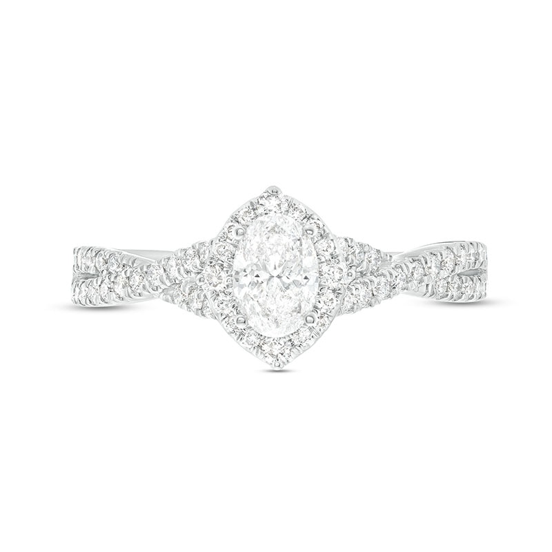 Previously Owned - Celebration Infinite™ Canadian Certified Oval Centre Diamond 0.80 CT. T.W. Frame Engagement Ring in 14K White Gold