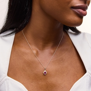 Oval Certified Ruby and 0.065 CT. T.W. Diamond Arabesque Frame Pendant in 10K Gold