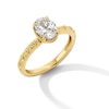 Thumbnail Image 1 of 0.99 CT. T.W. Oval Canadian Certified Diamond "XO" Shank Engagement Ring in 14K Gold (I/I1)