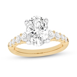 3.75 CT. T.W. Oval Certified Lab-Grown Diamond Graduated Shank Engagement Ring in 14K Gold (F/VS2)