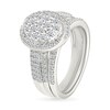 CT. T.W. Oval-Shaped Multi-Diamond Swirl Frame Triple Row Bridal Set in 10K Gold