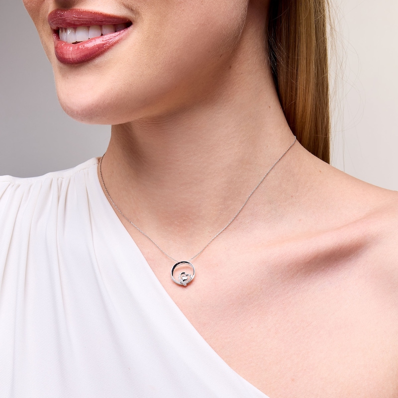 0.10 CT. T.W. Diamond Heart Circle Pendant in Sterling Silver