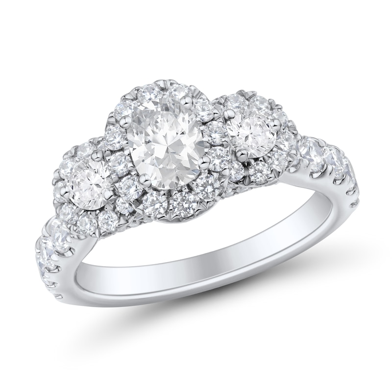 1.95 CT. T.W. Oval and Round Diamond Frame Three Stone Engagement Ring in 14K White Gold