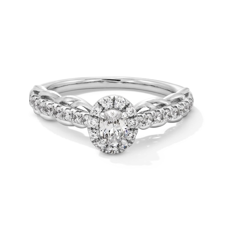 0.50 CT. T.W. Oval Diamond Frame Scallop Shank Engagement Ring in 10K Gold