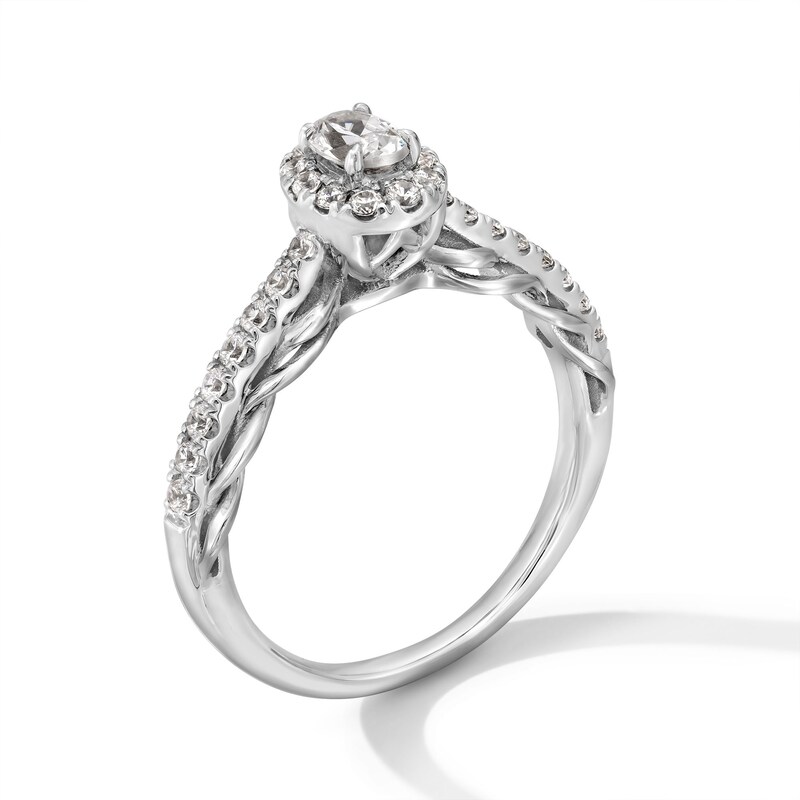 0.50 CT. T.W. Oval Diamond Frame Scallop Shank Engagement Ring in 10K Gold