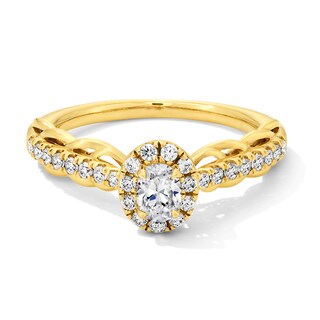 0.50 CT. T.W. Oval Diamond Frame Scallop Shank Engagement Ring in 10K Gold