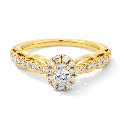 0.50 CT. T.W. Oval Diamond Frame Scallop Shank Engagement Ring in 10K Gold