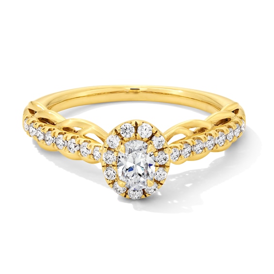 0.50 CT. T.W. Oval Diamond Frame Scallop Shank Engagement Ring in 10K Gold