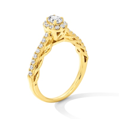 0.50 CT. T.W. Oval Diamond Frame Scallop Shank Engagement Ring in 10K Gold