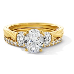 Perfect Fit 1.75 CT. T.W. Oval Certified Lab-Grown Diamond Three Stone Twist Shank Bridal Set in 14K Gold (F/VS2)
