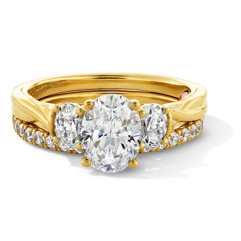 Perfect Fit 1.75 CT. T.W. Oval Certified Lab-Grown Diamond Three Stone Twist Shank Bridal Set in 14K Gold (F/VS2)
