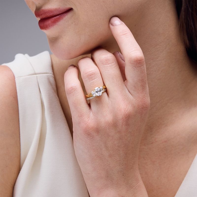Perfect Fit 1.75 CT. T.W. Oval Certified Lab-Grown Diamond Three Stone Twist Shank Bridal Set in 14K Gold (F/VS2)