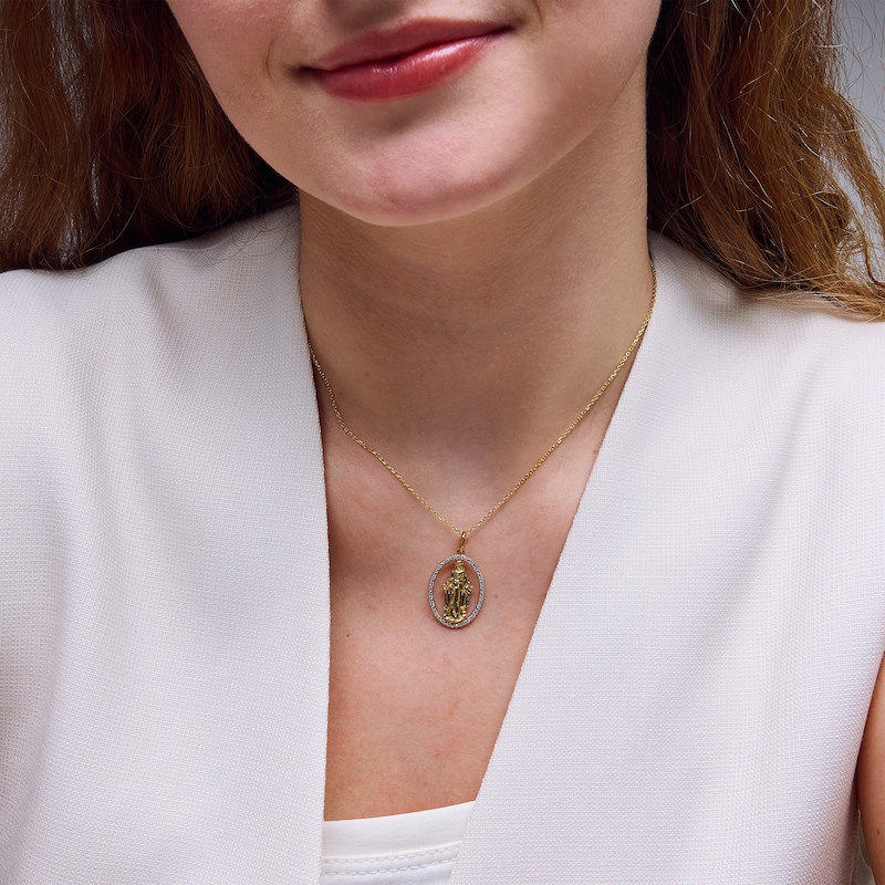 0.085 CT. T.W. Diamond Oval Frame Virgin Mary Pendant in 10K Gold