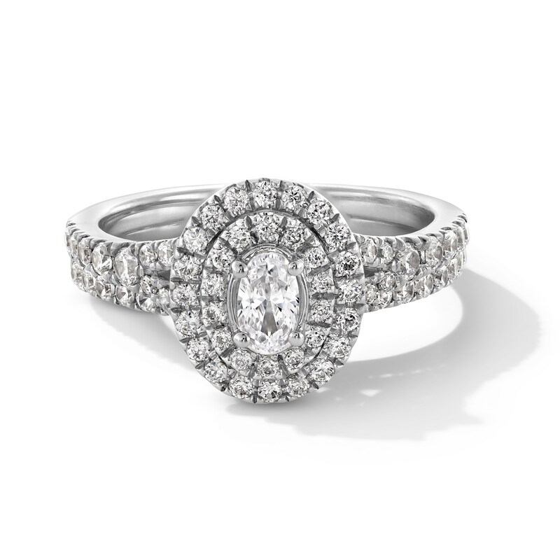 1.00 CT. T.W. Oval Canadian Certified Centre Diamond Double Frame Bridal Set in 14K White Gold (I/I1)