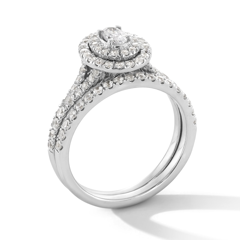 1.00 CT. T.W. Oval Canadian Certified Centre Diamond Double Frame Bridal Set in 14K White Gold (I/I1)