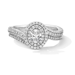 1.00 CT. T.W. Oval Canadian Certified Centre Diamond Double Frame Bypass Bridal Set in 14K White Gold (I/I1)