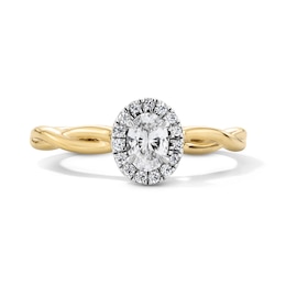 0.40 CT. T.W. Oval Canadian Certified Centre Diamond Frame Engagement Ring in 10K Gold (I/SI2)