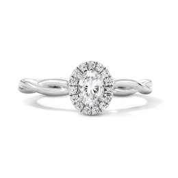 0.40 CT. T.W. Oval Canadian Certified Centre Diamond Frame Engagement Ring in 10K White Gold (I/SI2)