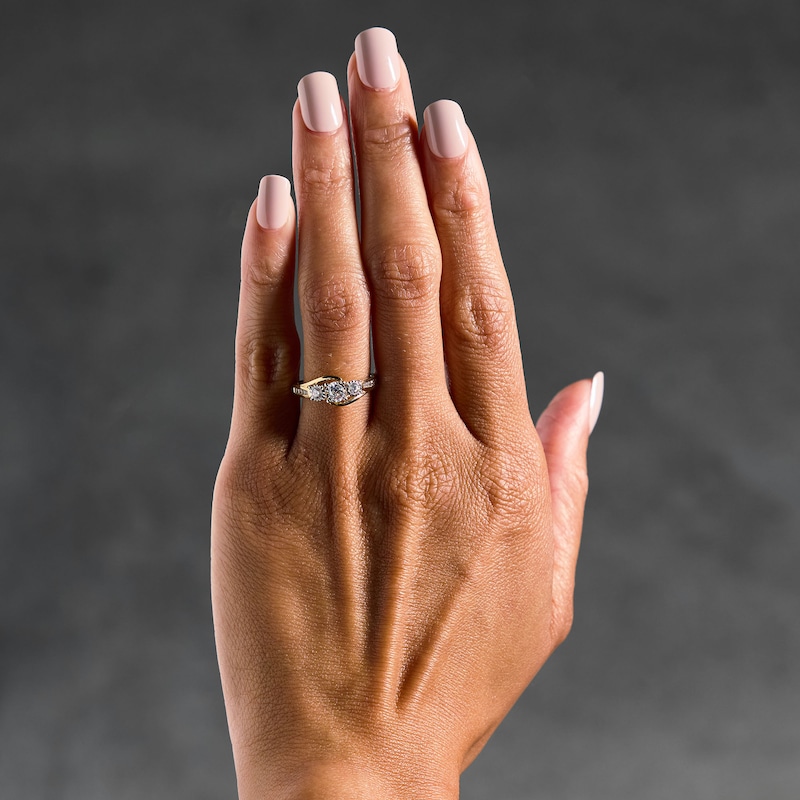 Main Image 2 of 0.50 CT. T.W. Diamond Three-Stone Bypass Engagement Ring in 14K Gold