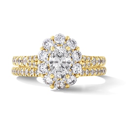 1.50 CT. T.W. Oval Canadian Certified Diamond Frame Bridal Set in 14K Gold (I/I1)