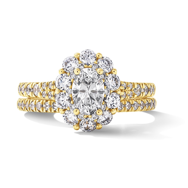 1.50 CT. T.W. Oval Canadian Certified Diamond Frame Bridal Set 14K Gold (I/I1)