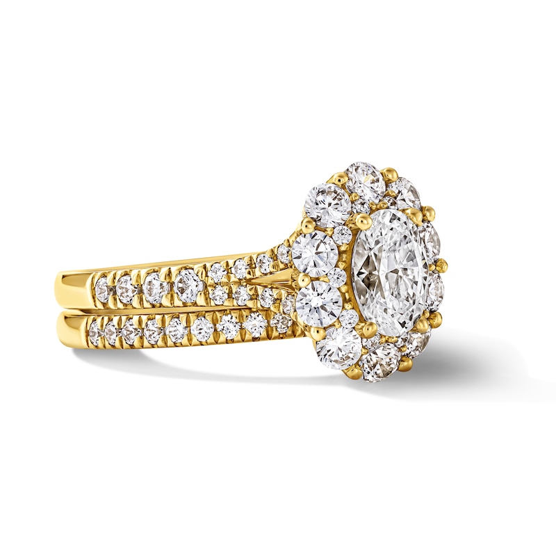 1.50 CT. T.W. Oval Canadian Certified Diamond Frame Bridal Set 14K Gold (I/I1)