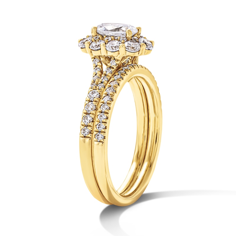 1.50 CT. T.W. Oval Canadian Certified Diamond Frame Bridal Set 14K Gold (I/I1)