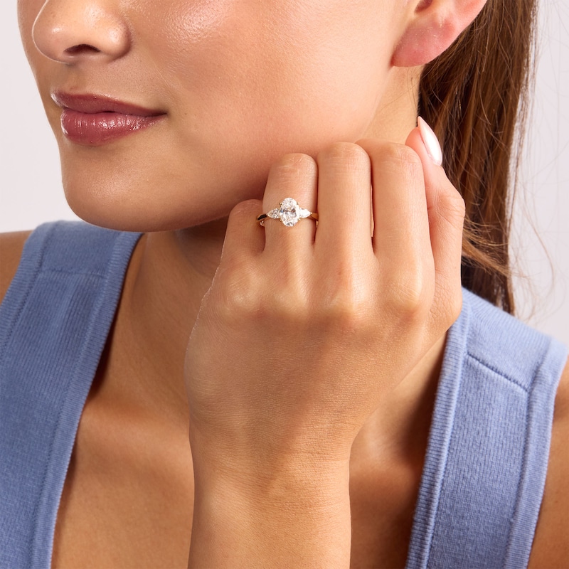 1.55 CT. T.W. Certified Oval and Pear-Shaped Lab-Grown Diamond Three-Stone Engagement Ring 14K Gold (F/VS2