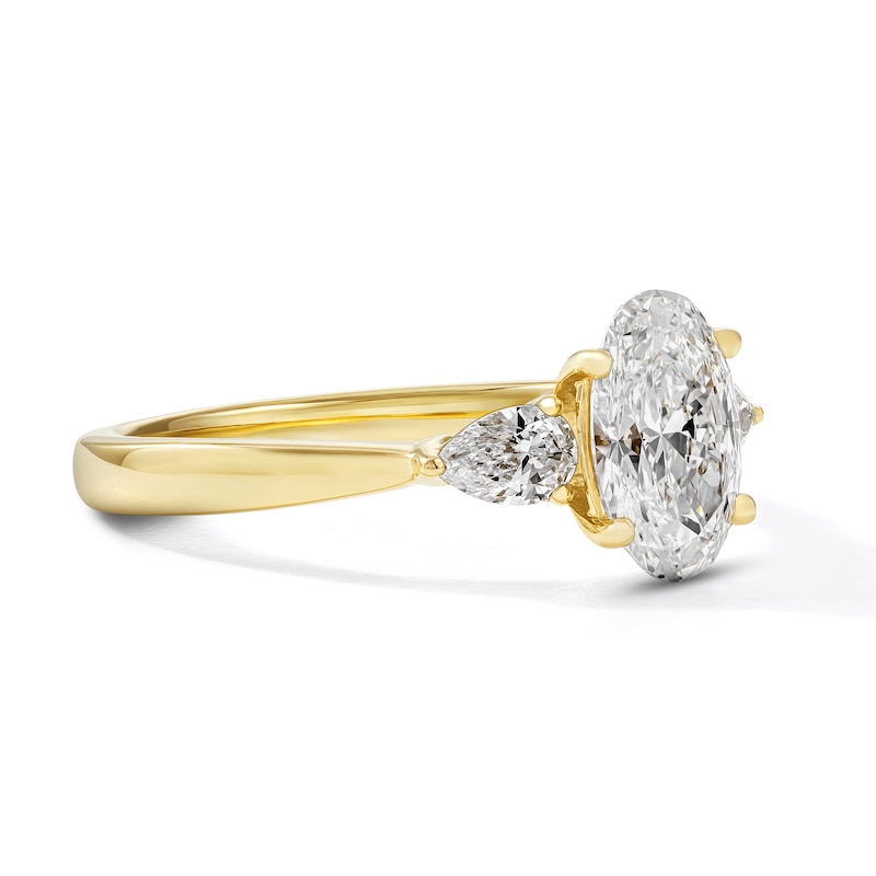 1.55 CT. T.W. Certified Oval and Pear-Shaped Lab-Grown Diamond Three-Stone Engagement Ring in 14K Gold (F/VS2