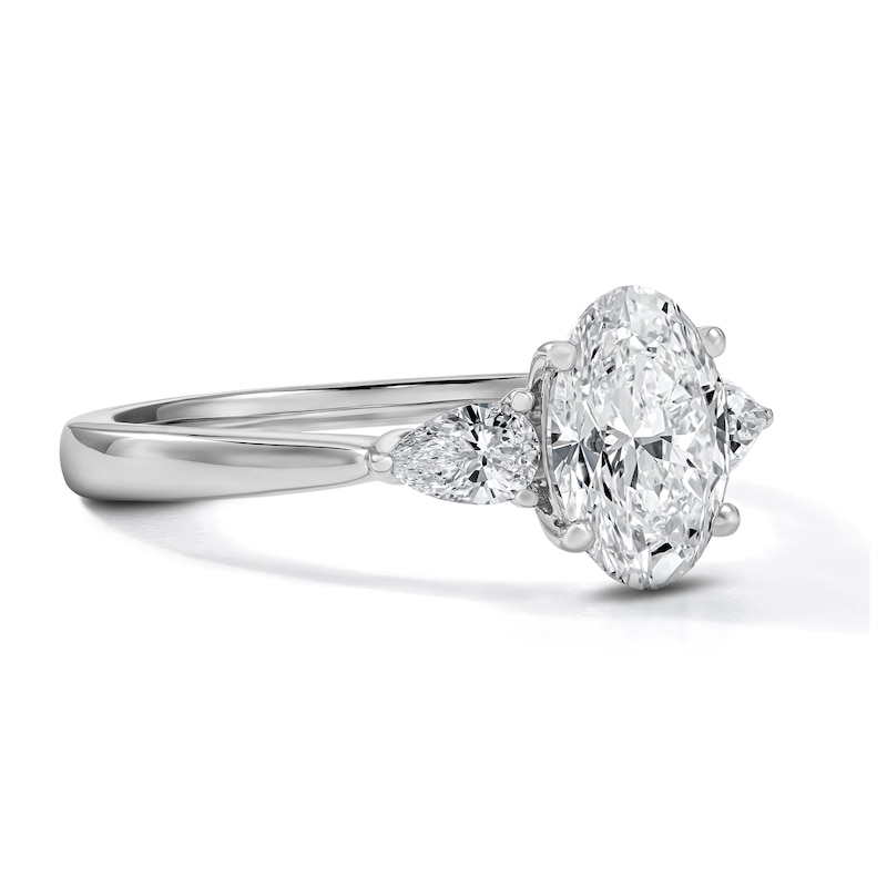 1.55 CT. T.W. Certified Oval and Pear-Shaped Lab-Grown Diamond Three-Stone Engagement Ring in 14K Gold (F/VS2