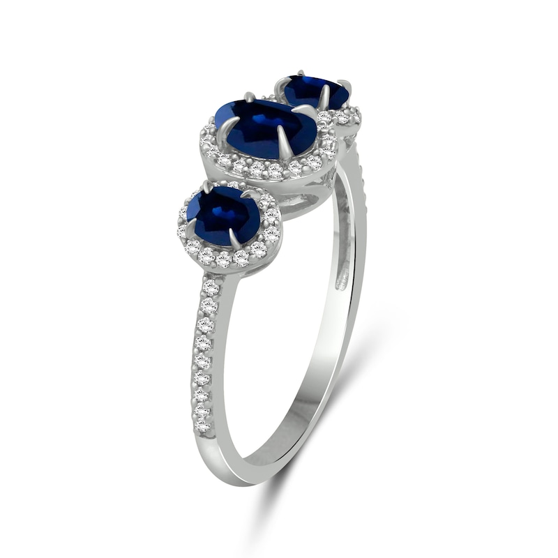 Oval Blue Sapphire and 0.15 CT. T.W. Diamond Three-Stone Frame Ring 10K White Gold