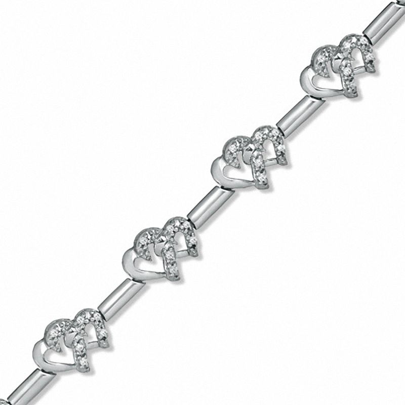 Previously Owned - 0.20 CT. T.W. Diamond Interlocking Hearts Link Bracelet in Sterling Silver|Peoples Jewellers