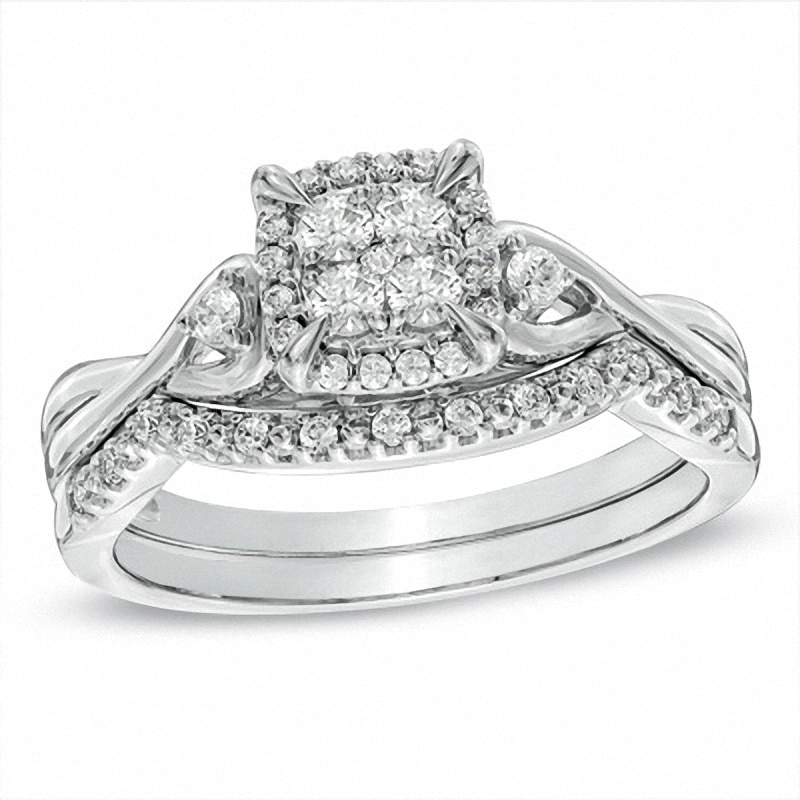 Previously Owned - 0.33 CT. T.W. Quad Diamond Twist Shank Bridal Set in 10K White Gold