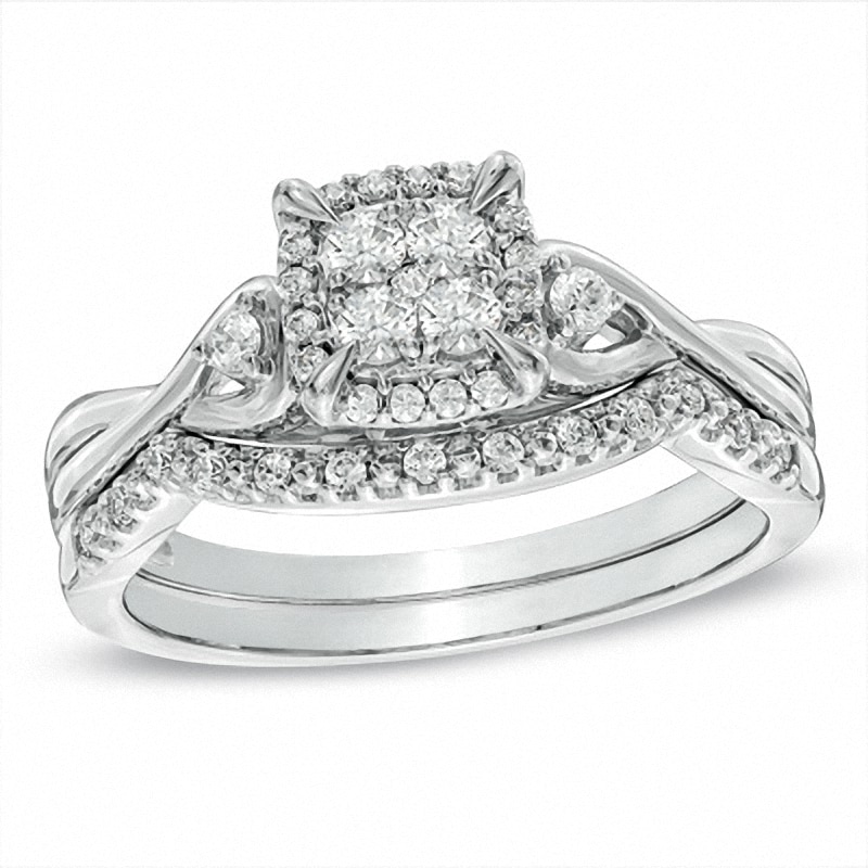 Previously Owned - 0.33 CT. T.W. Quad Diamond Twist Shank Bridal Set in 10K White Gold|Peoples Jewellers