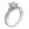 Previously Owned - 0.33 CT. T.W. Quad Diamond Twist Shank Bridal Set in 10K White Gold