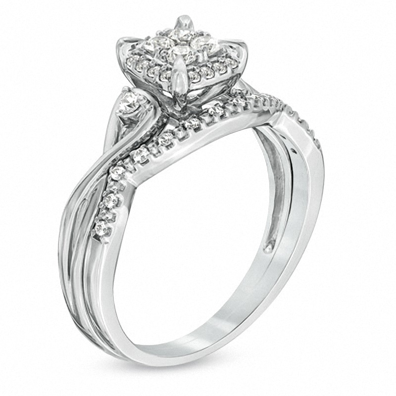 Previously Owned - 0.33 CT. T.W. Quad Diamond Twist Shank Bridal Set in 10K White Gold