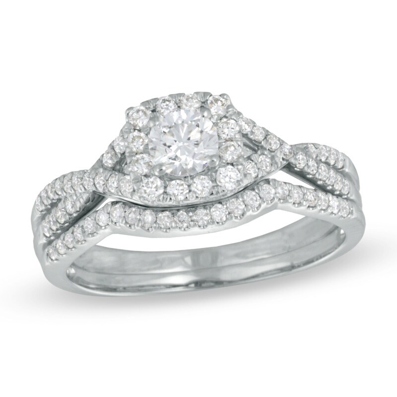 Previously Owned - 0.70 CT. T.W. Diamond Twist Shank Bridal Set 14K White Gold