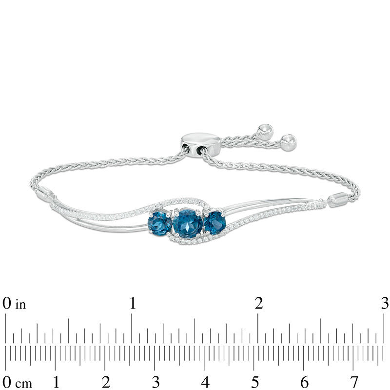 Previously Owned - London Blue Topaz and Lab-Created White Sapphire Three Stone Bolo Bracelet in Sterling Silver - 8.0"