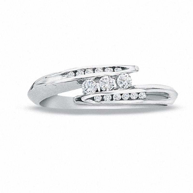 Previously Owned - 0.18 CT. T.W. Diamond Three Stone Bypass Ring in 10K White Gold